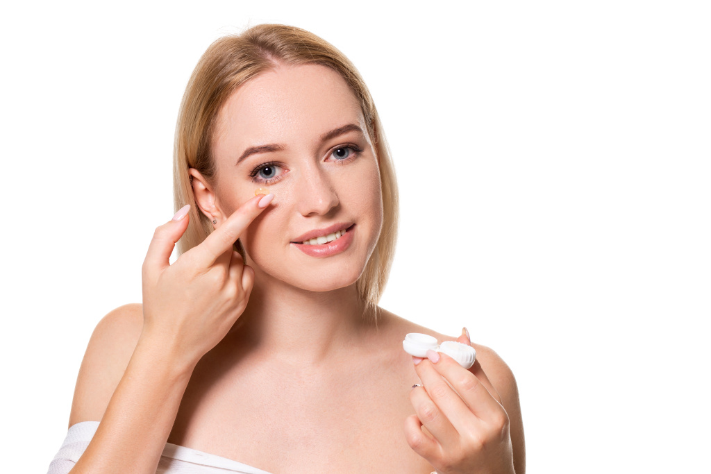 young-woman-holding-contact-lenses-cases-lens-front-her-face-white-background-eyesight-ophthalmology-concept.jpg