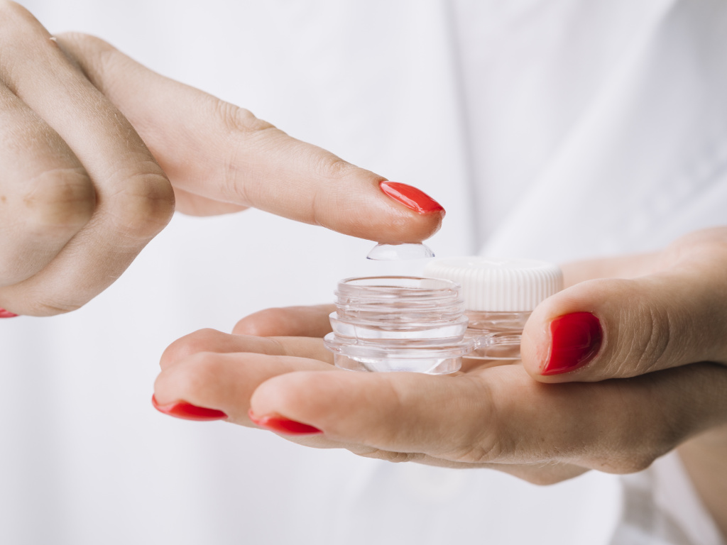 female-pulling-out-contact-lenses-from-box.jpg female-pulling-out-contact-lenses-from-box.jpg
